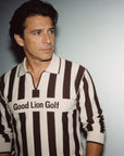 Man wearing a brown and white striped shirt with 'Good Lion Golf' text against a plain background