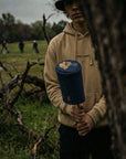 golfer holding a denim driver cover