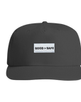 Black cap with 'GOOD > SAFE' text on a white background