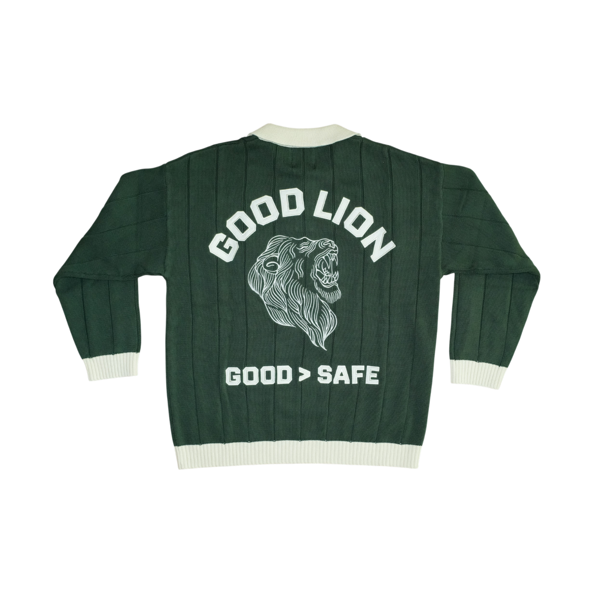 A dark forest green ribbed knit varsity-style jacket shown from the back, featuring a large white graphic of a roaring lion's head with the text 'GOOD LION' above and 'GOOD > SAFE' below, on a plain white background.