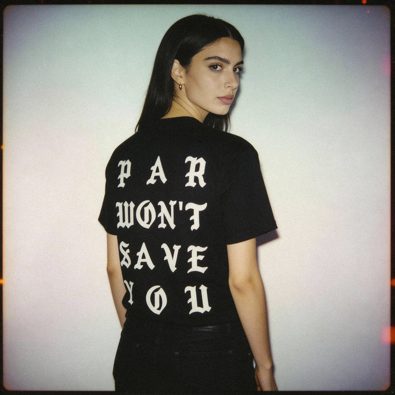 Person wearing a black t-shirt with white text on the back against a plain background
