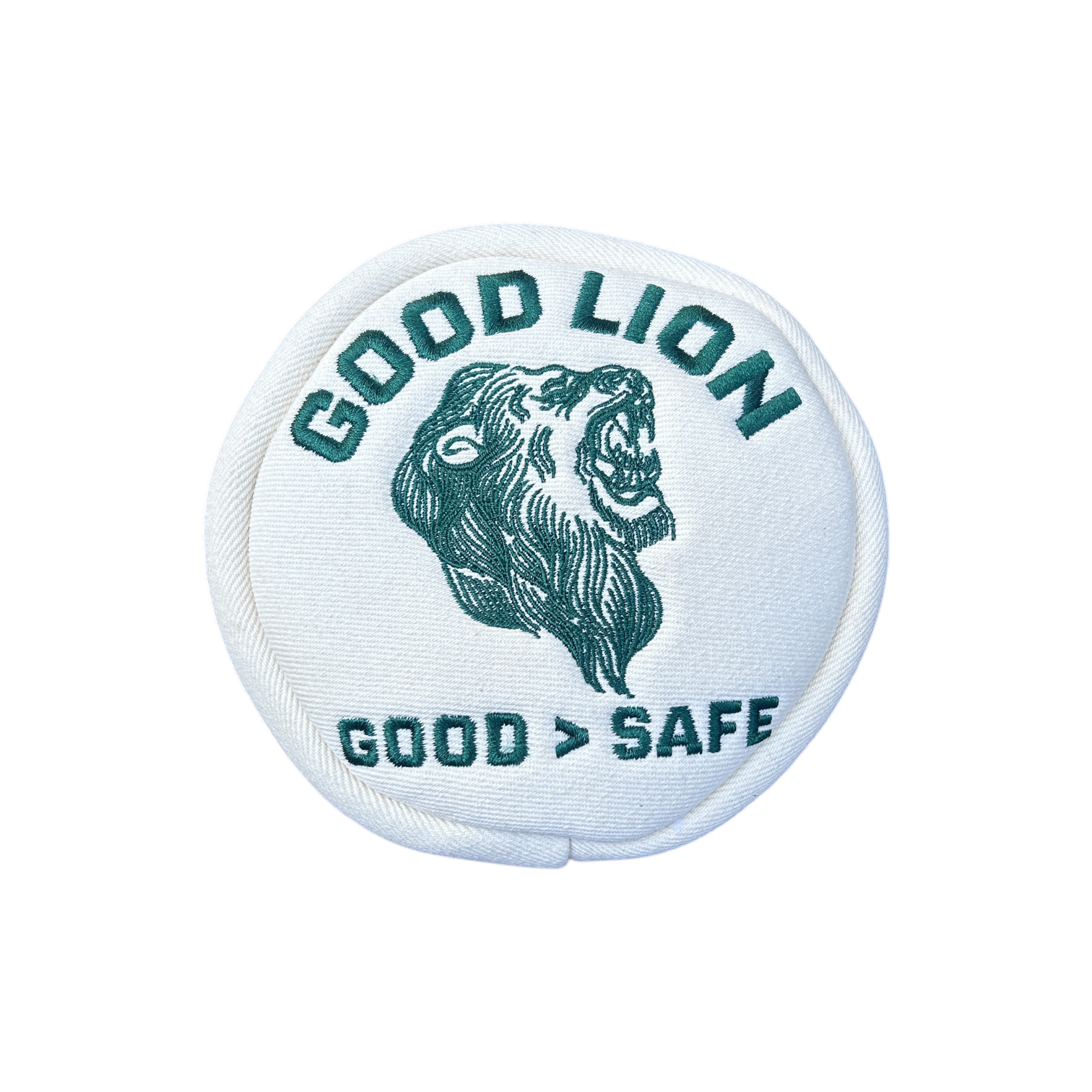 A circular white embroidered patch featuring a dark green lion head illustration with the text 'GOOD LION' above and 'GOOD > SAFE' below, shown on a plain white background.