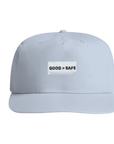 Light blue cap with 'GOOD > SAFE' patch on a white background
