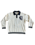 Vintage-style white long-sleeve shirt with black collar and trim on a white background
